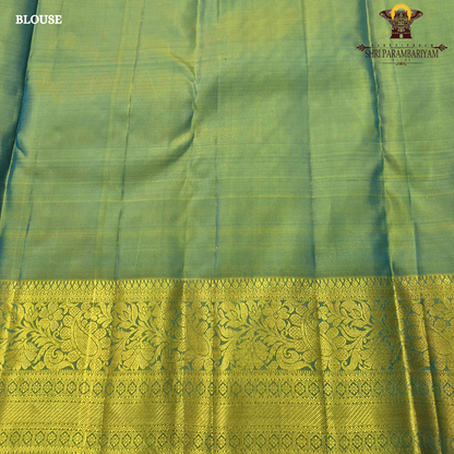 Vibrant royal blue with a rich gold zari border featuring a subtle green undertone Saree