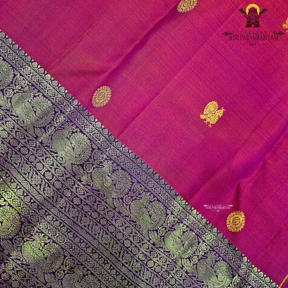 A bright vermilion red with a rich violet/purple border Saree