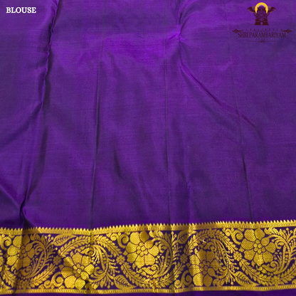 A vibrant turquoise blue / sea green body paired with a rich purple 2-inch border Saree