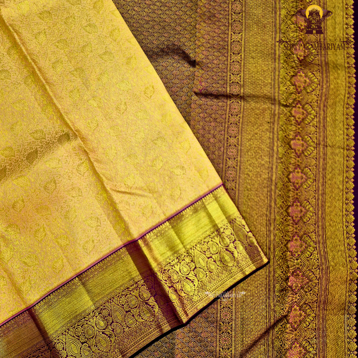 A golden mustard with rich gold zari weaving, complemented by a deep maroon (wine) korvai border Saree