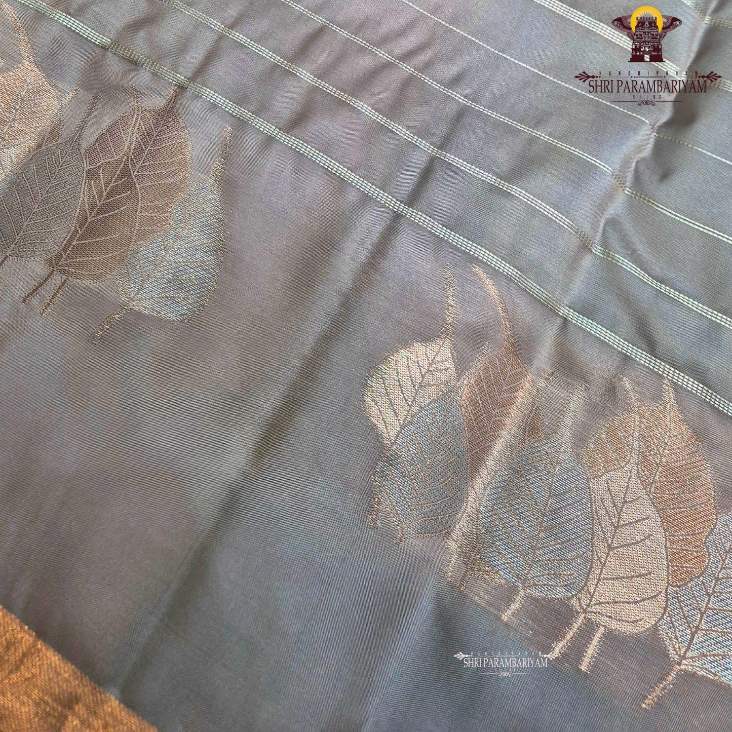 Dusty rose / muted pink shade with a soft metallic sheen Saree