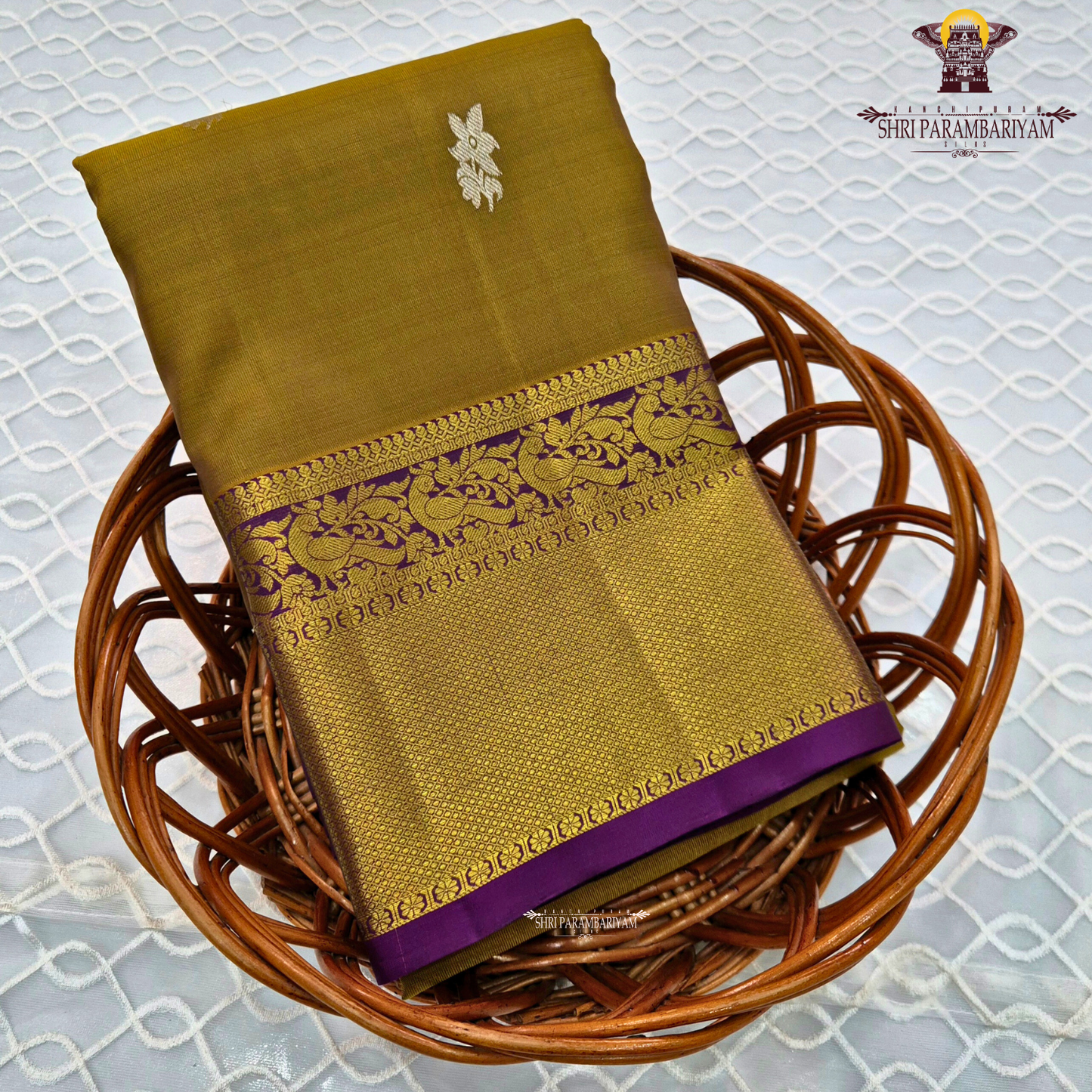A rich mustard gold body paired with a contrasting deep purple 2-inch border enhanced with intricate gold zari Saree