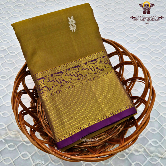 A rich mustard gold body paired with a contrasting deep purple 2-inch border enhanced with intricate gold zari Saree
