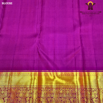 A golden mustard with rich gold zari weaving, complemented by a deep maroon (wine) korvai border Saree