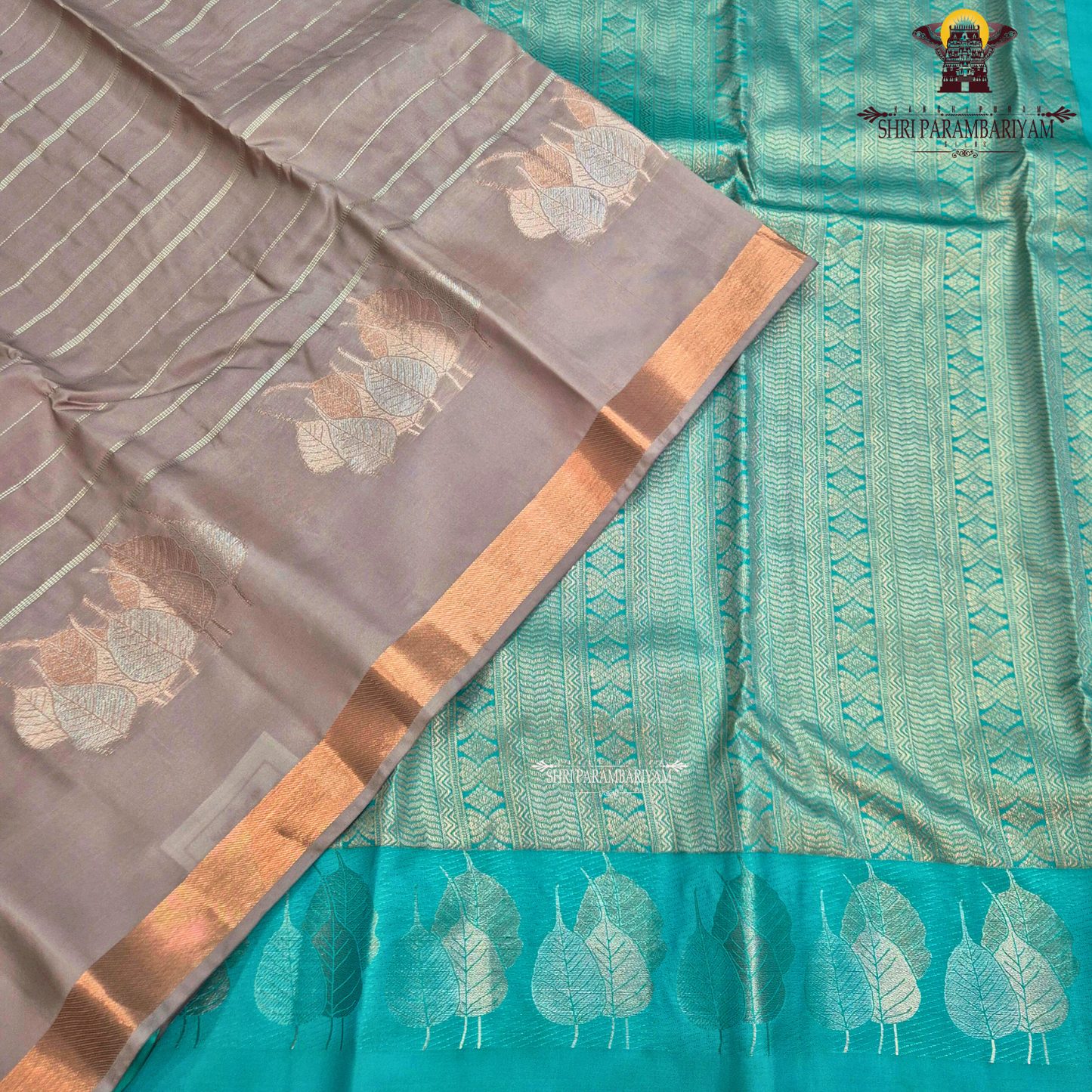 Dusty rose / muted pink shade with a soft metallic sheen Saree
