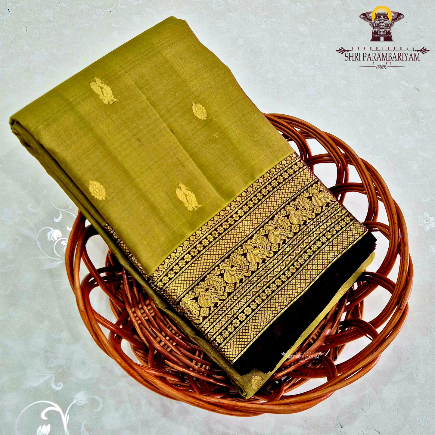 A graceful olive green / moss green shade with a soft natural sheen Saree