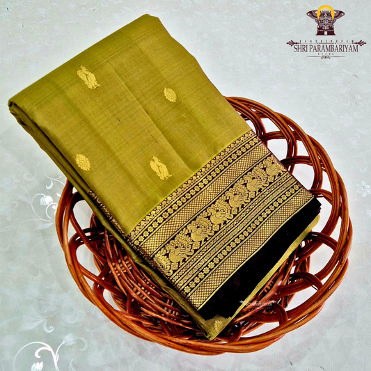 A graceful olive green / moss green shade with a soft natural sheen Saree