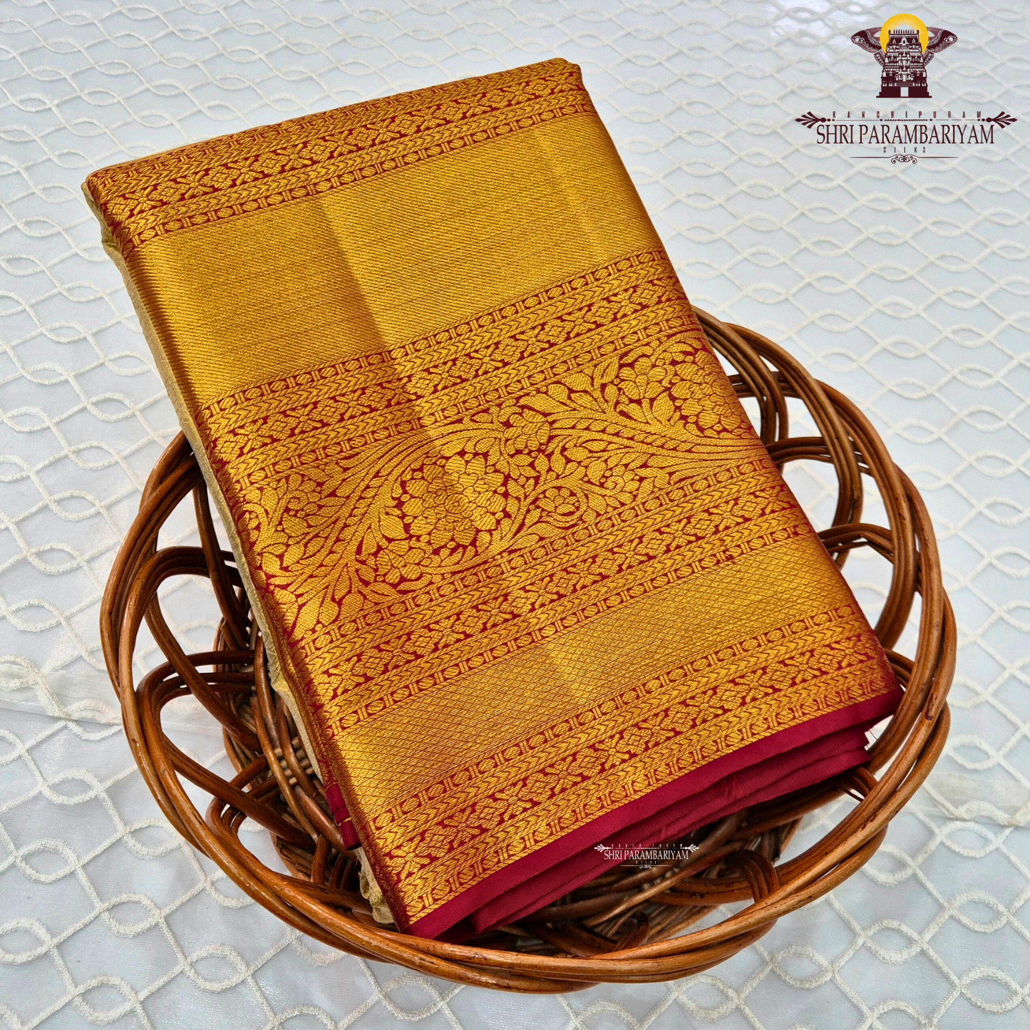A elegant pastel silver-grey / ivory body paired with a rich antique gold border Saree