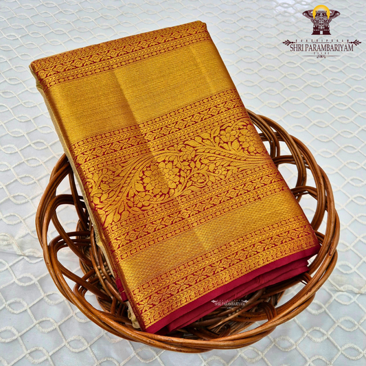 A elegant pastel silver-grey / ivory body paired with a rich antique gold border Saree