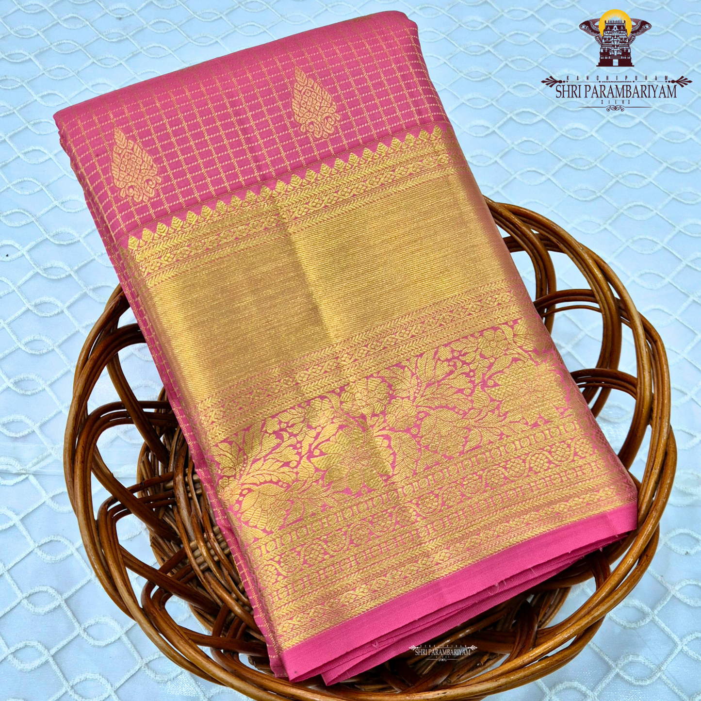 A vibrant bubblegum pink / rose pink body paired with a rich golden zari pallu and border Saree