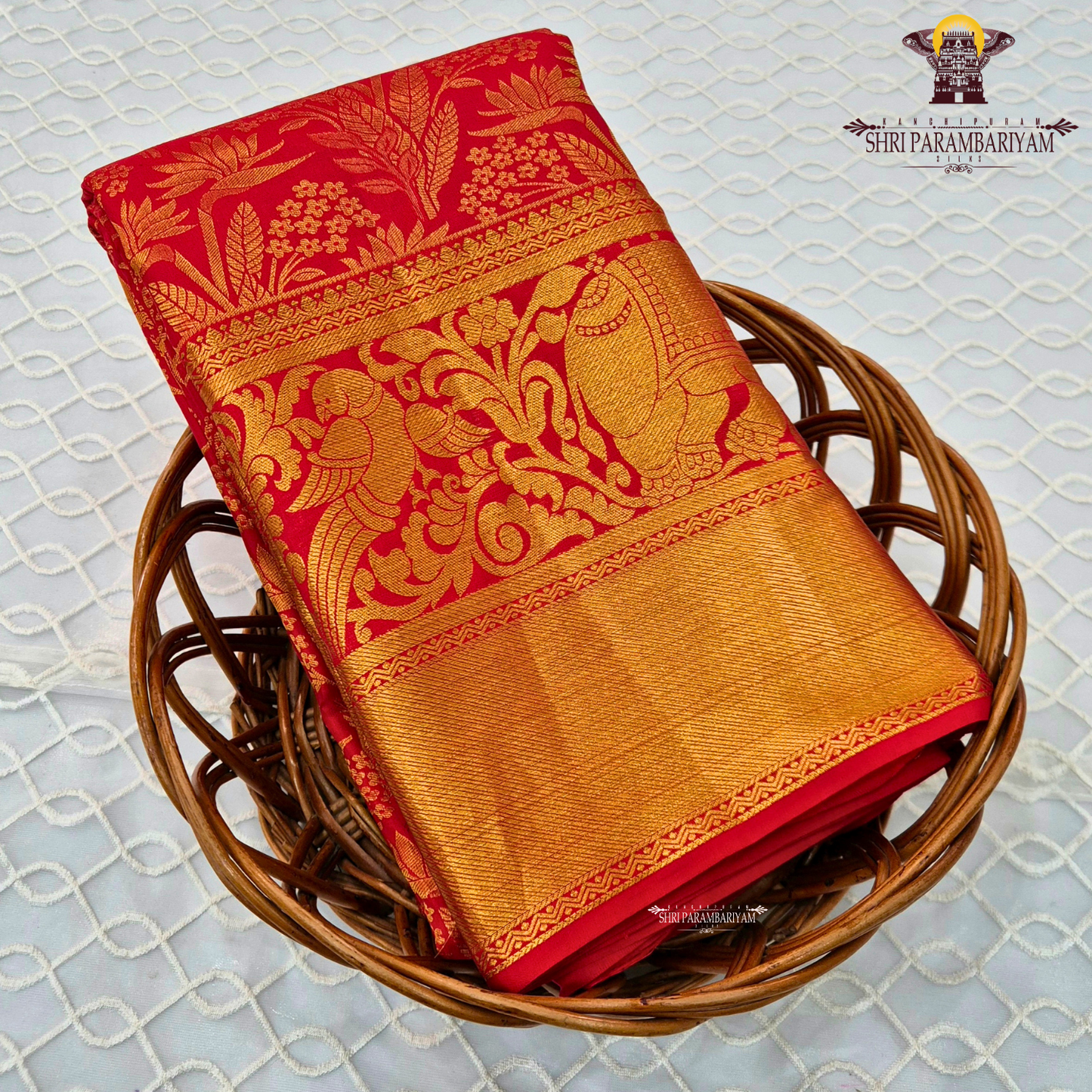 Rich bridal red base with Accentuated with bright gold zari work Saree