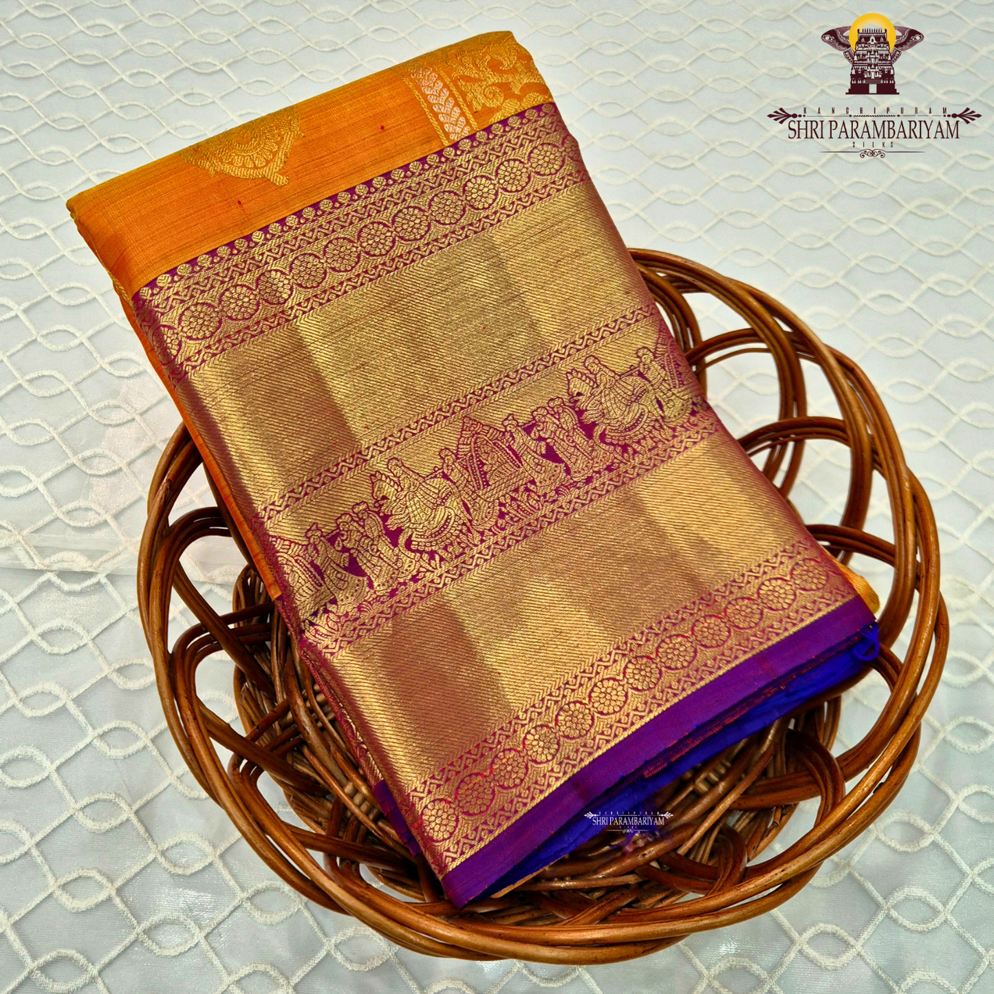 A vibrant combination of bright turmeric yellow (mustard yellow) with rich gold zari and purple contrast Saree
