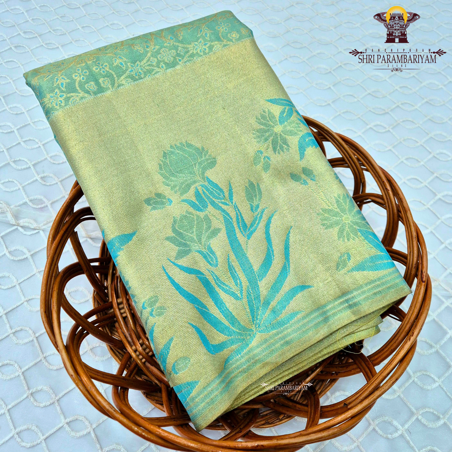A soothing pastel pista green with a soft gold tissue sheen Saree