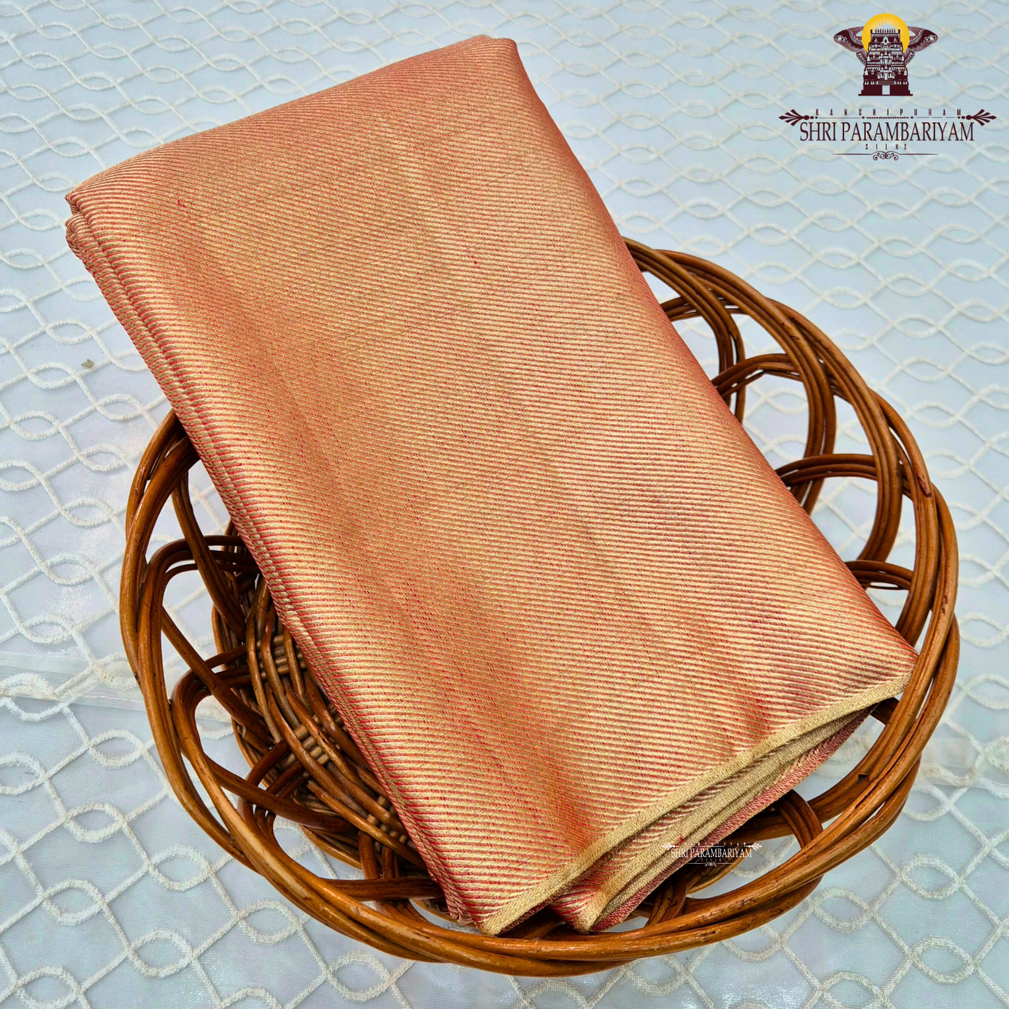 A beautiful peach gold shade blended with a soft pink undertone Saree