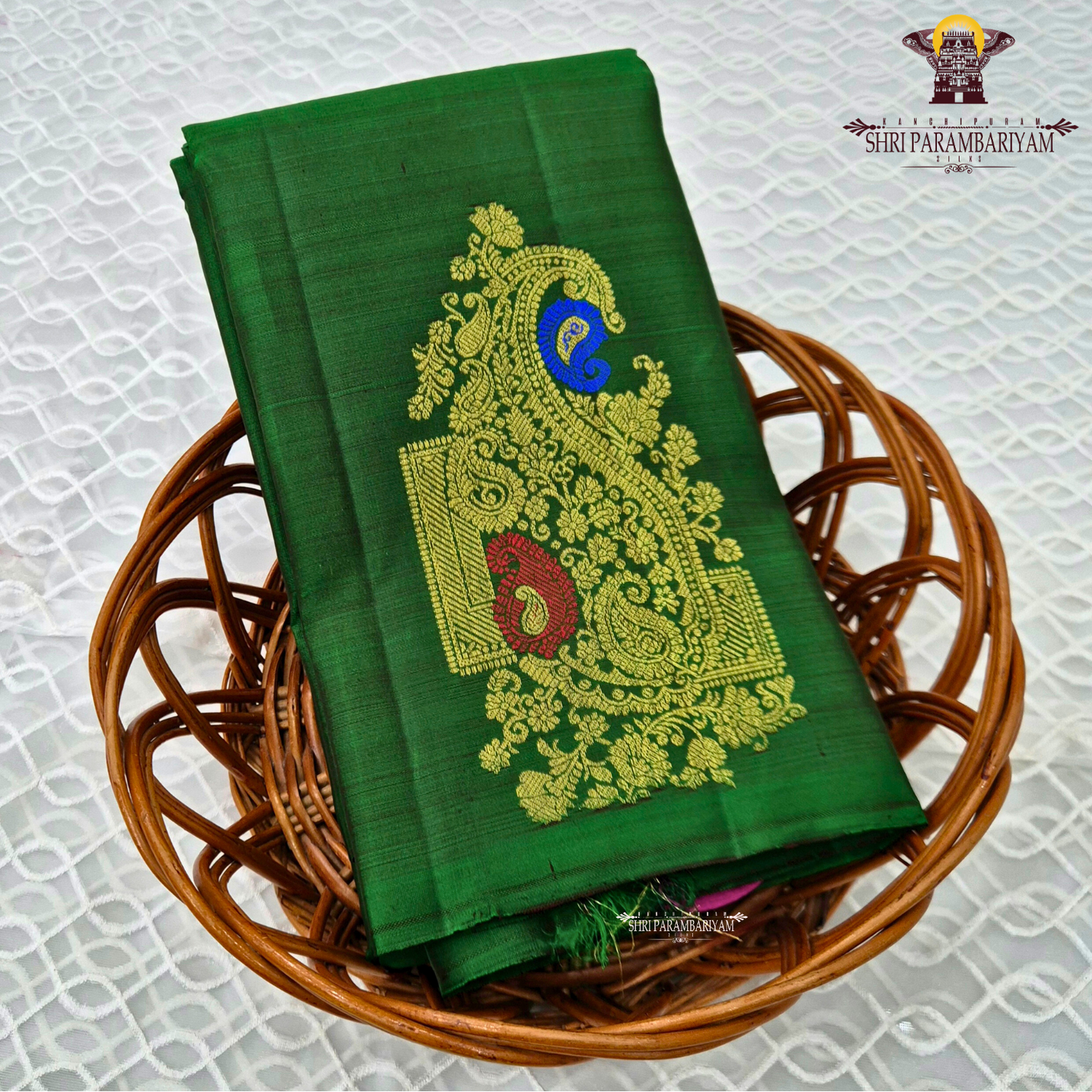 A rich emerald green body highlighted Saree