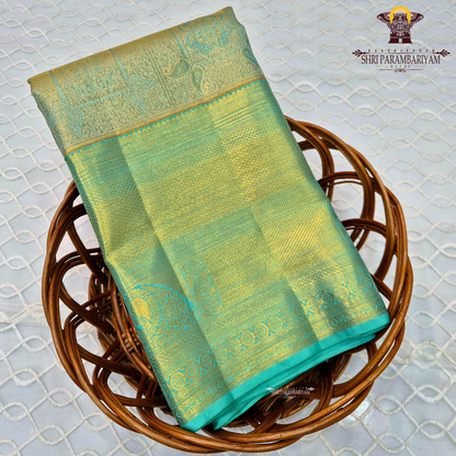 A refreshing sea green shade beautifully blended with rich gold tissue Saree