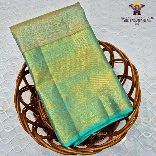 A refreshing sea green shade beautifully blended with rich gold tissue Saree