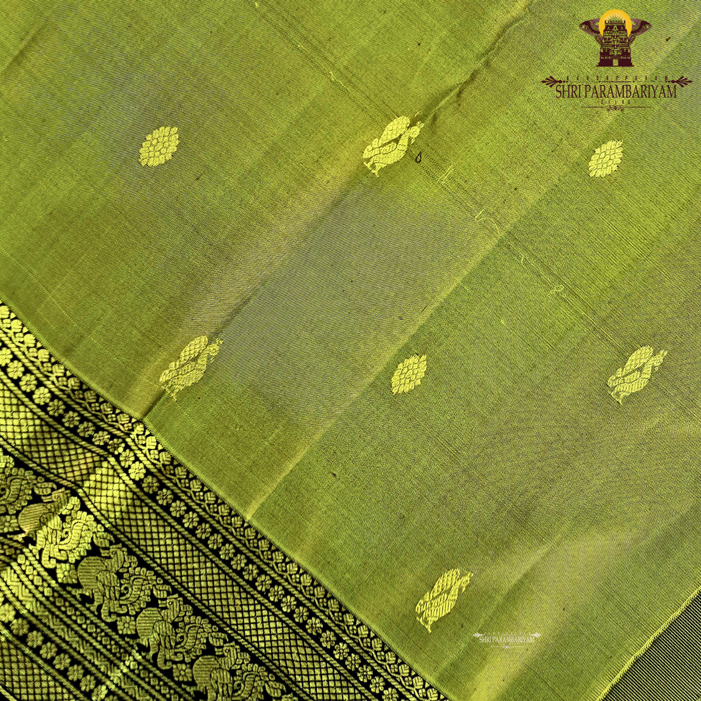 A graceful olive green / moss green shade with a soft natural sheen Saree