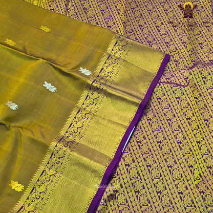 A rich mustard gold body paired with a contrasting deep purple 2-inch border enhanced with intricate gold zari Saree