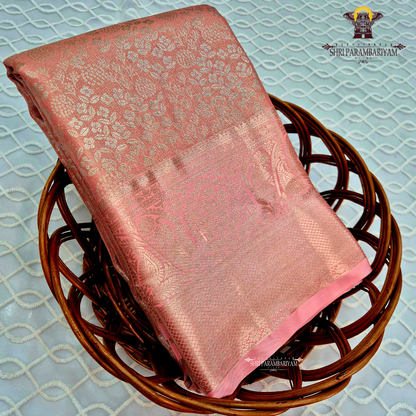 Soft blush pink with an elegant metallic tissue sheen Saree