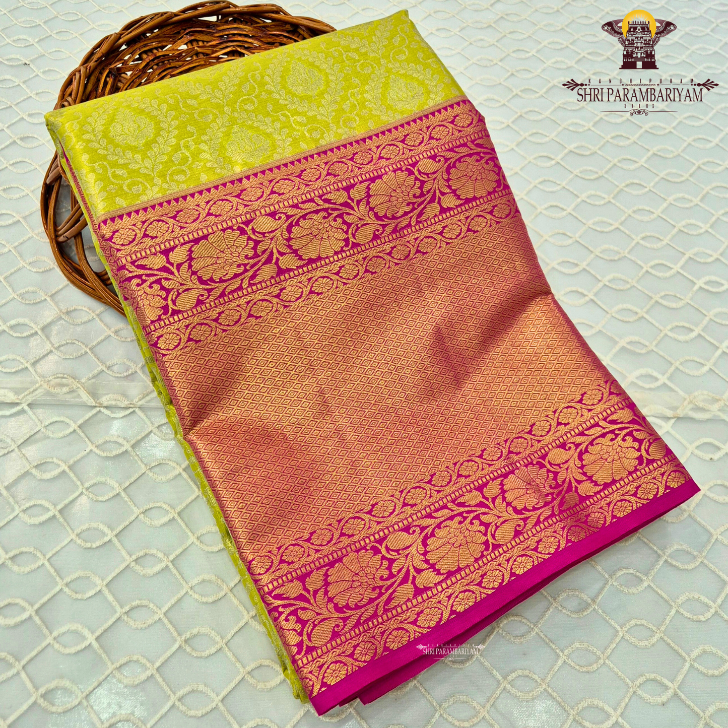 Vibrant lime green with rich pink contrast and golden zari Saree