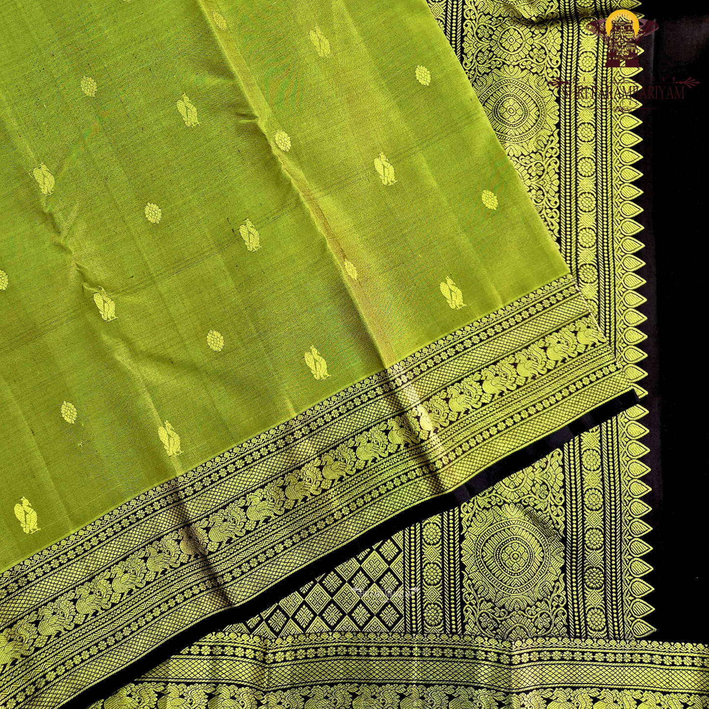 A graceful olive green / moss green shade with a soft natural sheen Saree