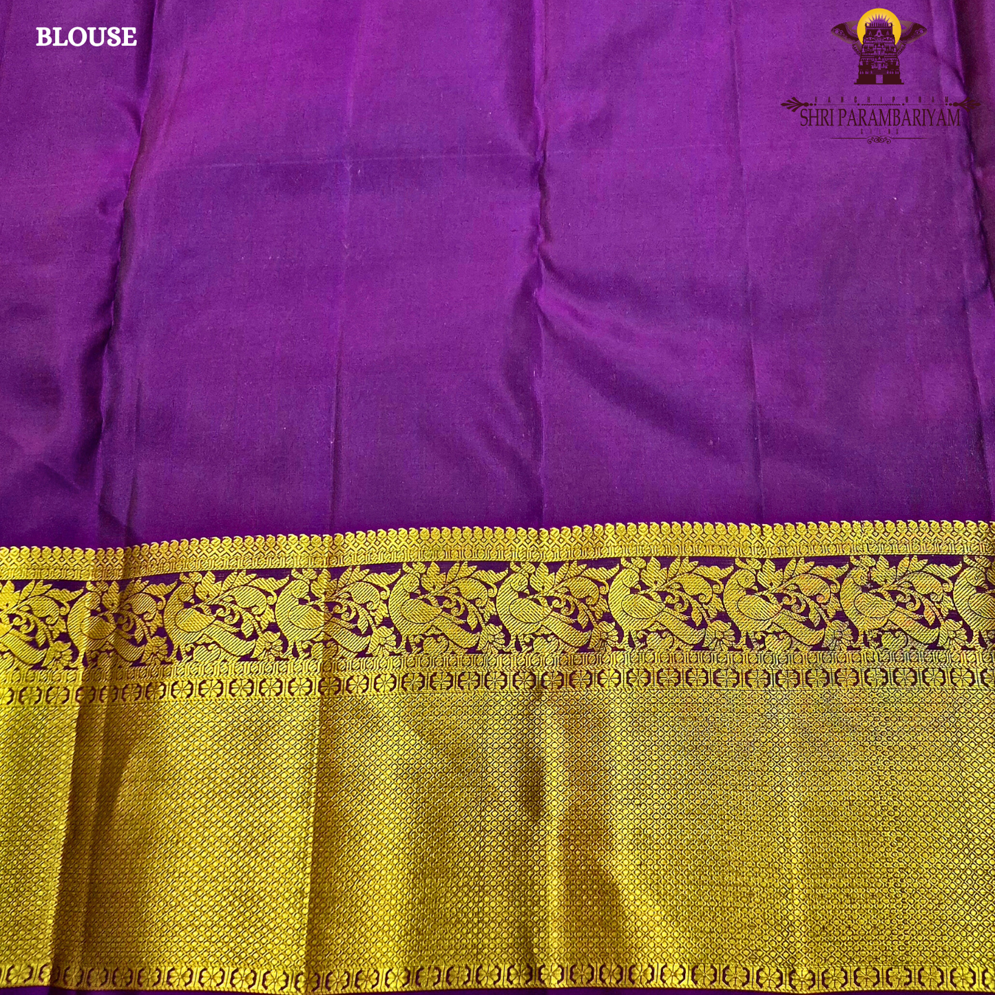 A rich mustard gold body paired with a contrasting deep purple 2-inch border enhanced with intricate gold zari Saree