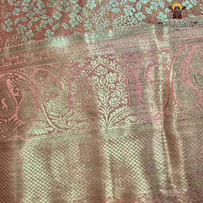 Soft blush pink with an elegant metallic tissue sheen Saree