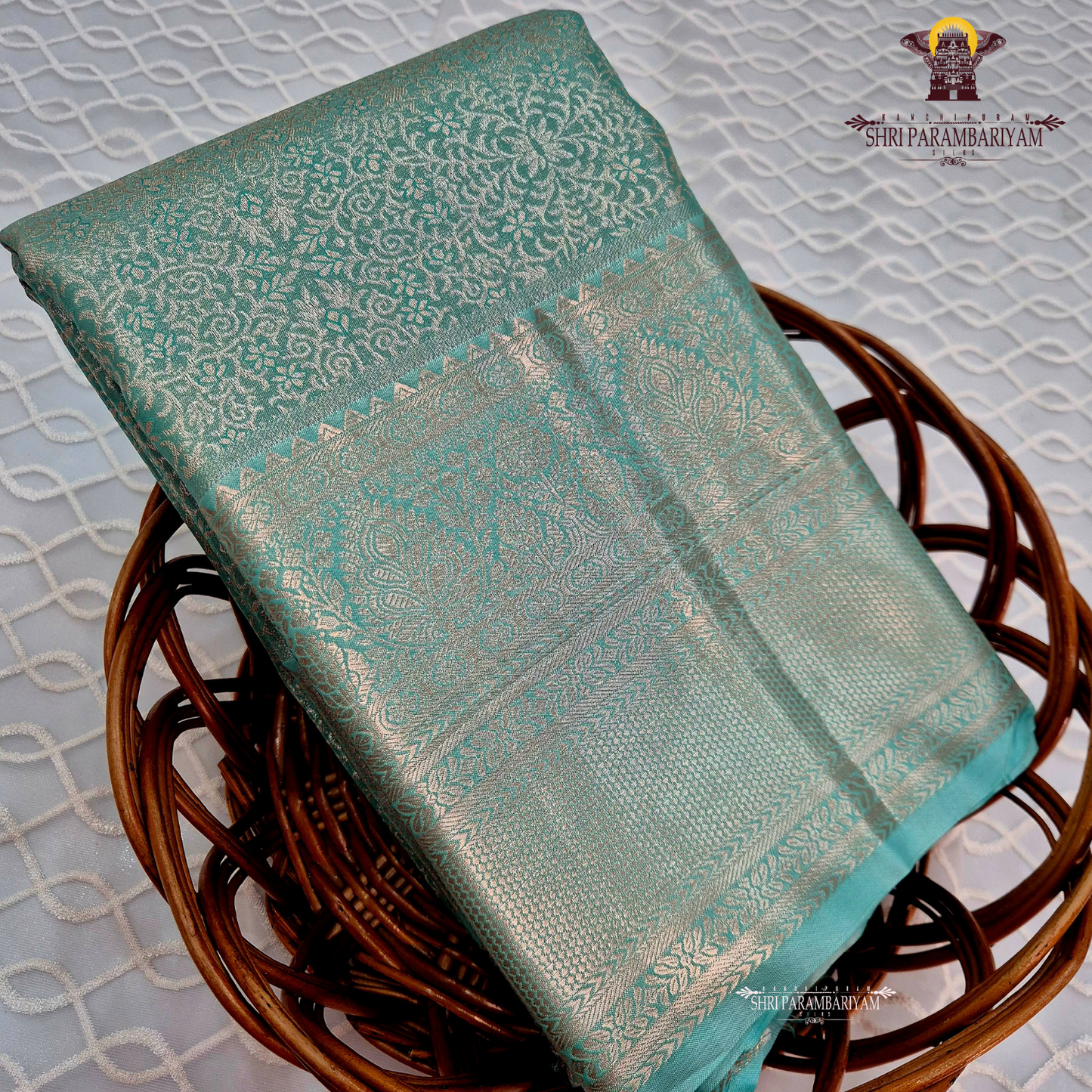 Serene sea-green / aqua teal with a soft metallic tissue sheen Saree