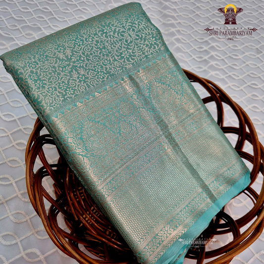 Serene sea-green / aqua teal with a soft metallic tissue sheen Saree