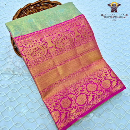 Soft pastel green with vibrant pink contrast and golden zari Saree