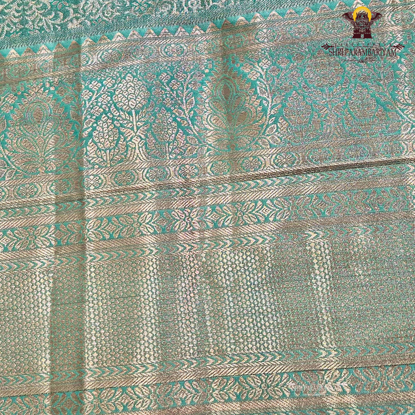 Serene sea-green / aqua teal with a soft metallic tissue sheen Saree