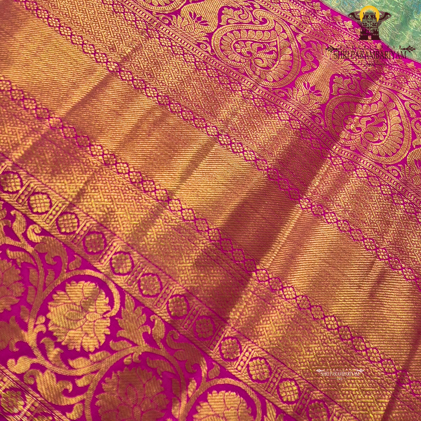 Soft pastel green with vibrant pink contrast and golden zari Saree