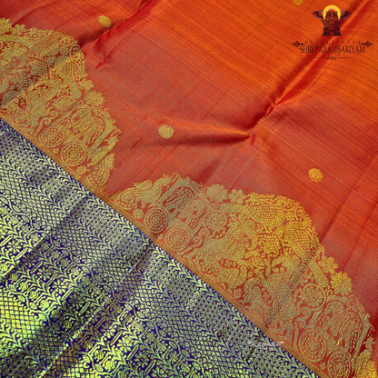 Vibrant reddish-orange (vermilion tone) body with a contrasting Saree