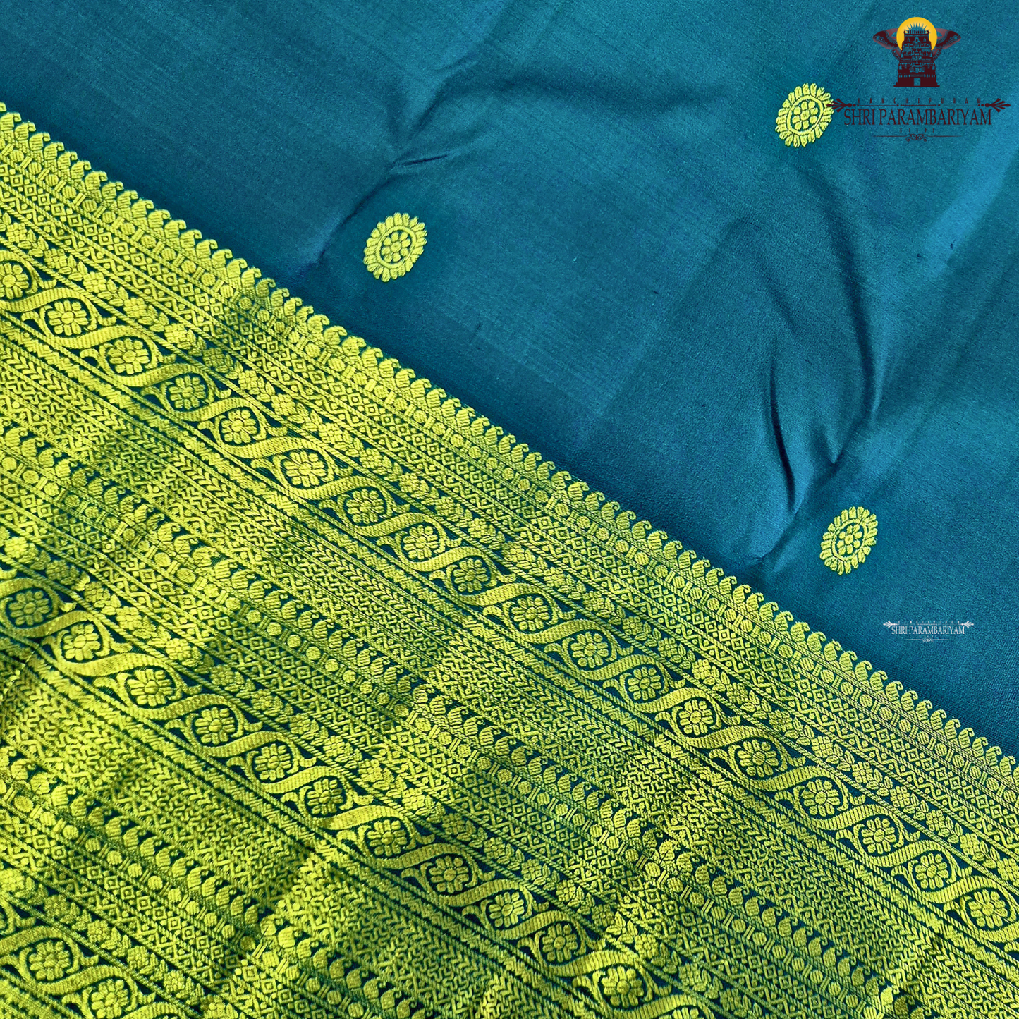 A stunning royal teal blue body adorned with delicate gold zari Saree