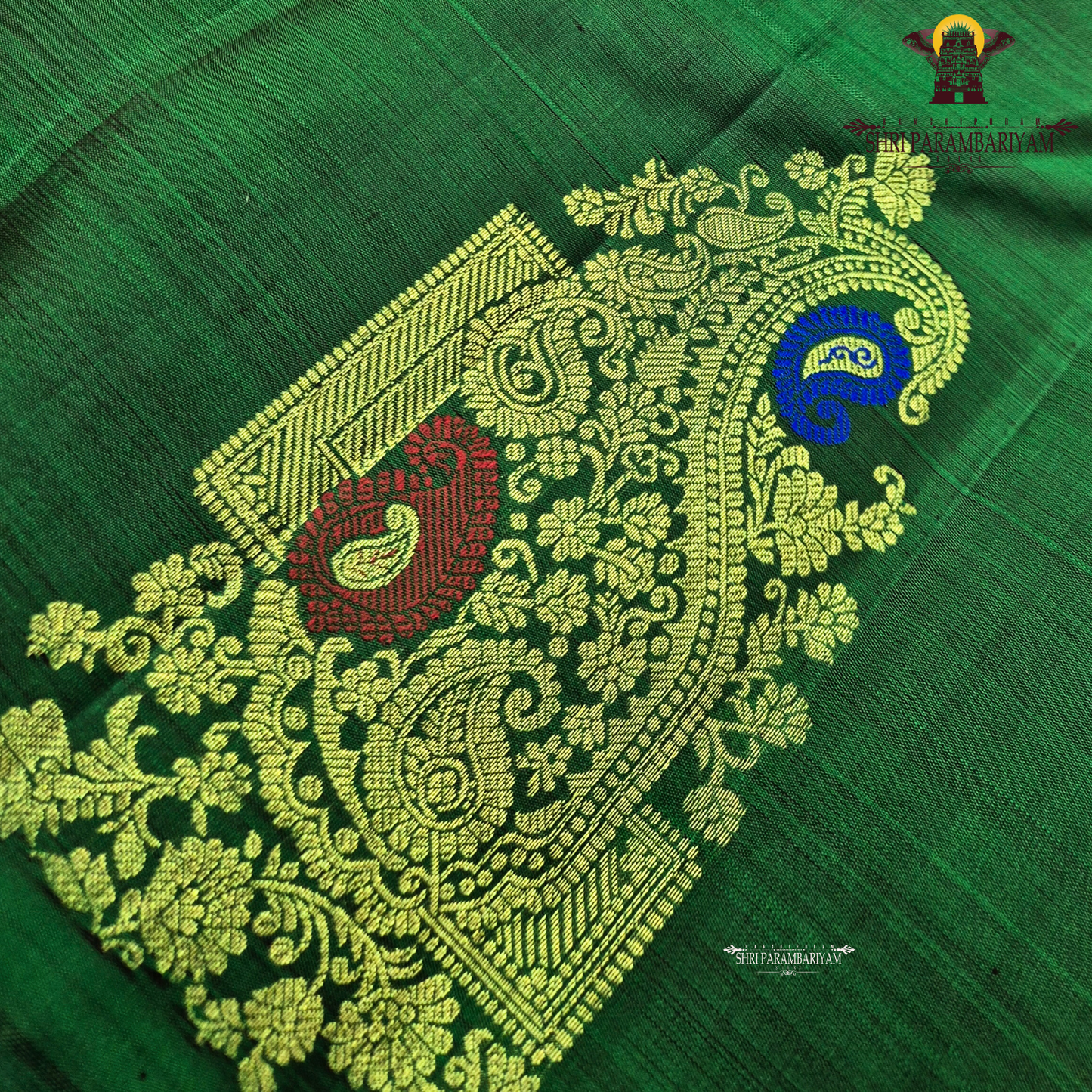 A rich emerald green body highlighted Saree