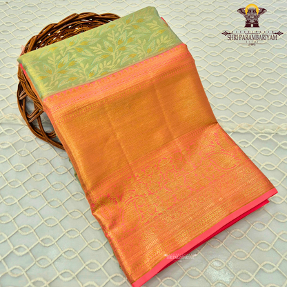 Refreshing pastel green (mint green) body paired with a rich golden-orange Saree