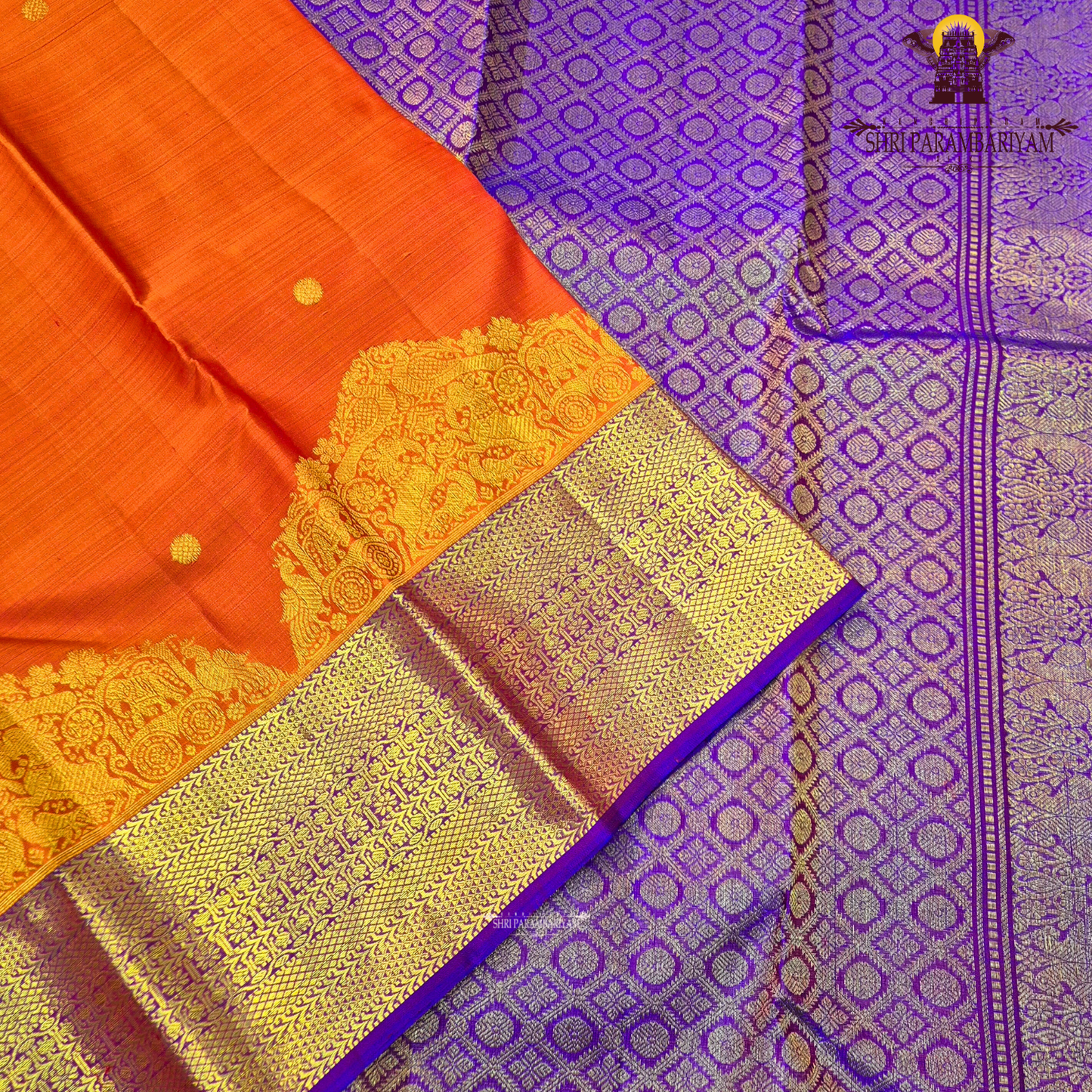 Vibrant reddish-orange (vermilion tone) body with a contrasting Saree