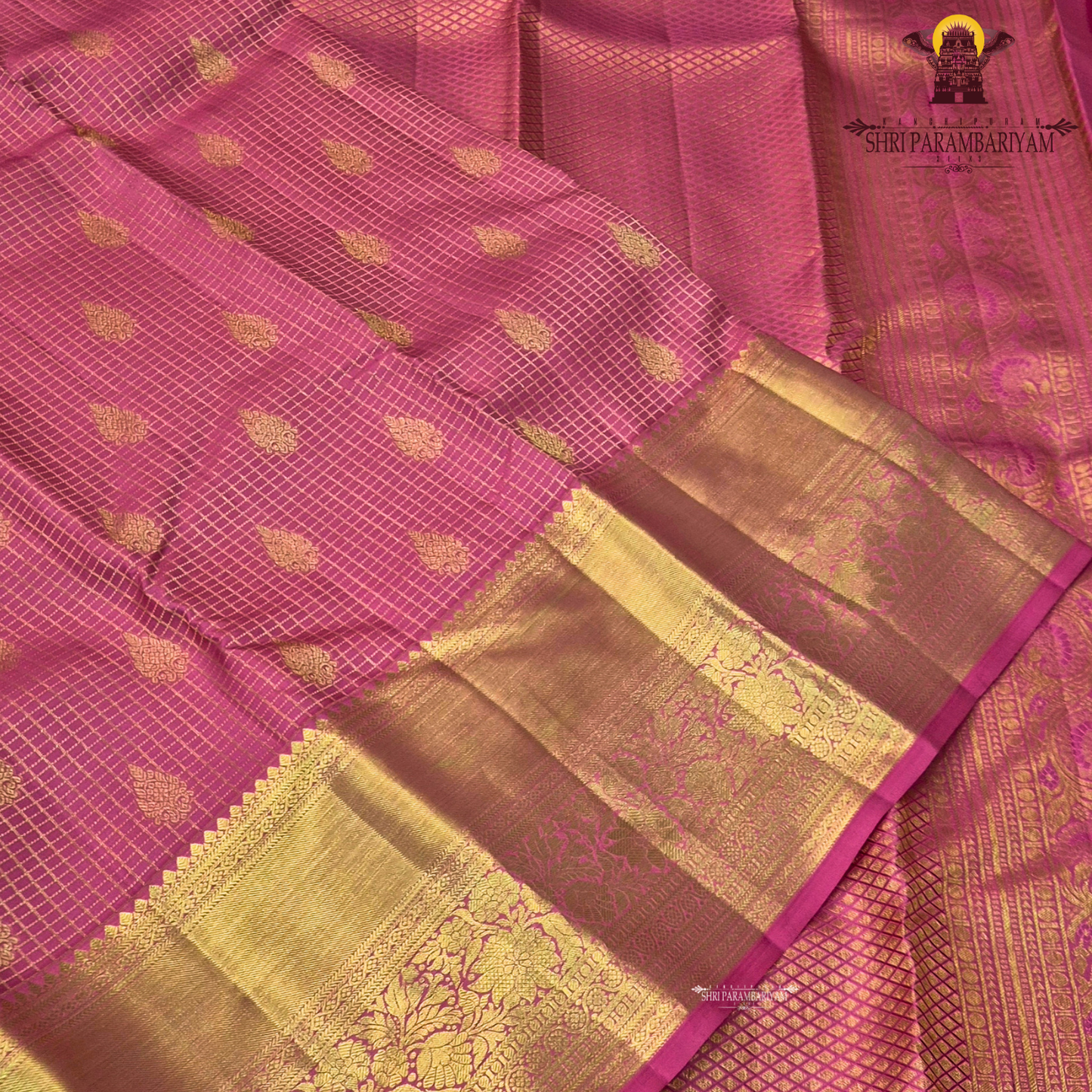 A vibrant bubblegum pink / rose pink body paired with a rich golden zari pallu and border Saree