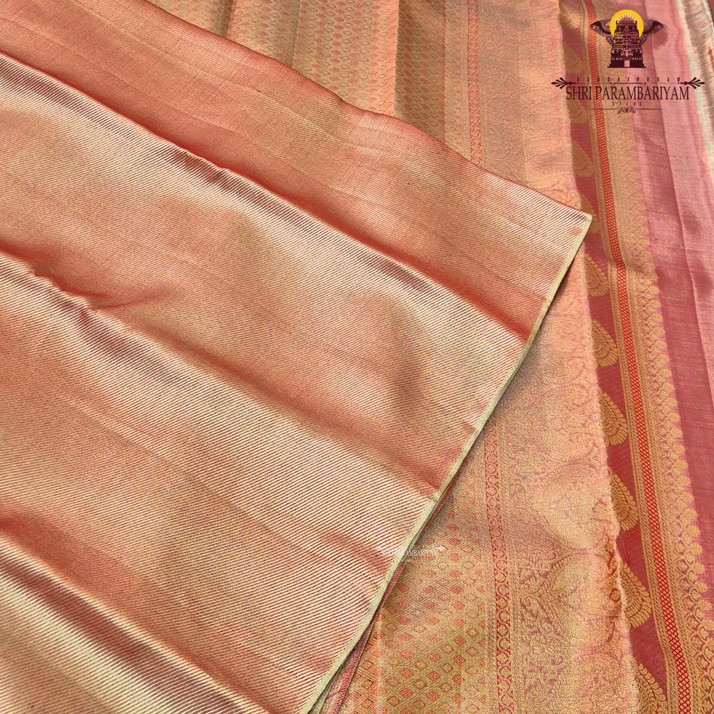 A beautiful peach gold shade blended with a soft pink undertone Saree