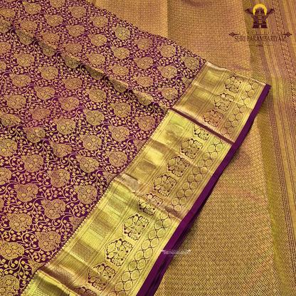 Rich maroon / deep wine purple with luxurious gold zari work Saree