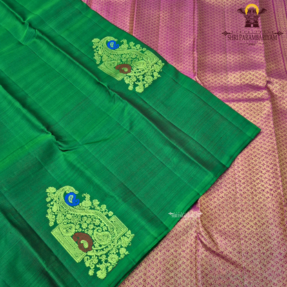 A rich emerald green body highlighted Saree