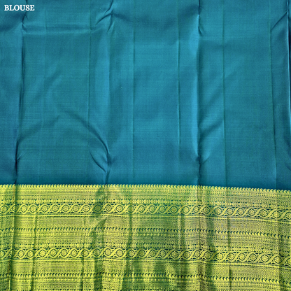 A stunning royal teal blue body adorned with delicate gold zari Saree