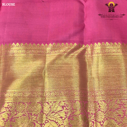 A vibrant bubblegum pink / rose pink body paired with a rich golden zari pallu and border Saree