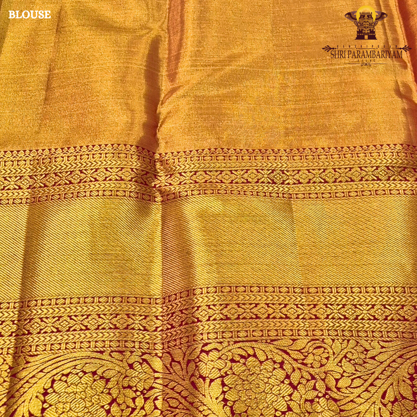 A elegant pastel silver-grey / ivory body paired with a rich antique gold border Saree