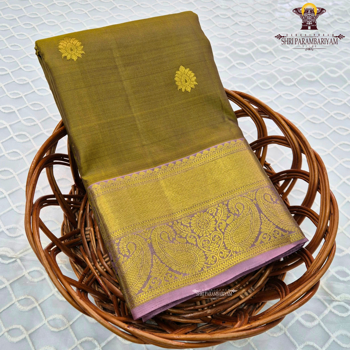 Rich olive green shade with elegant gold zari Saree
