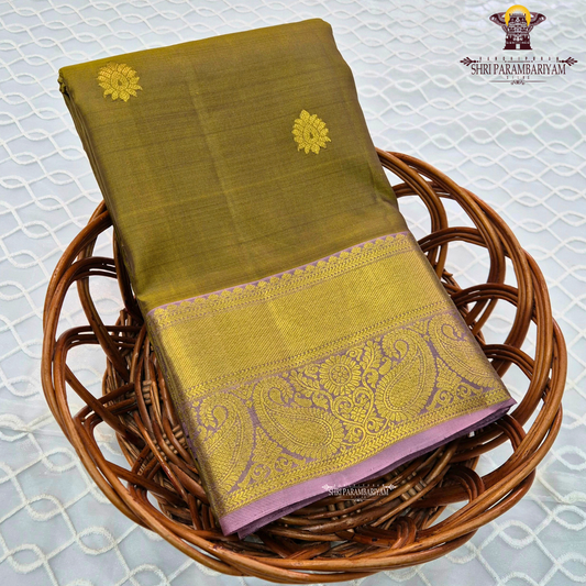 Rich olive green shade with elegant gold zari Saree