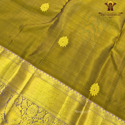 Rich olive green shade with elegant gold zari Saree