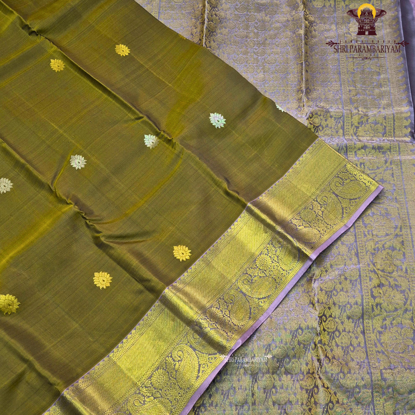Rich olive green shade with elegant gold zari Saree