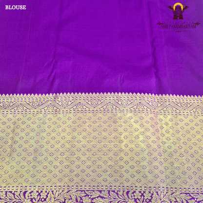 A rich cream/ivory base with a contrasting royal purple border Saree